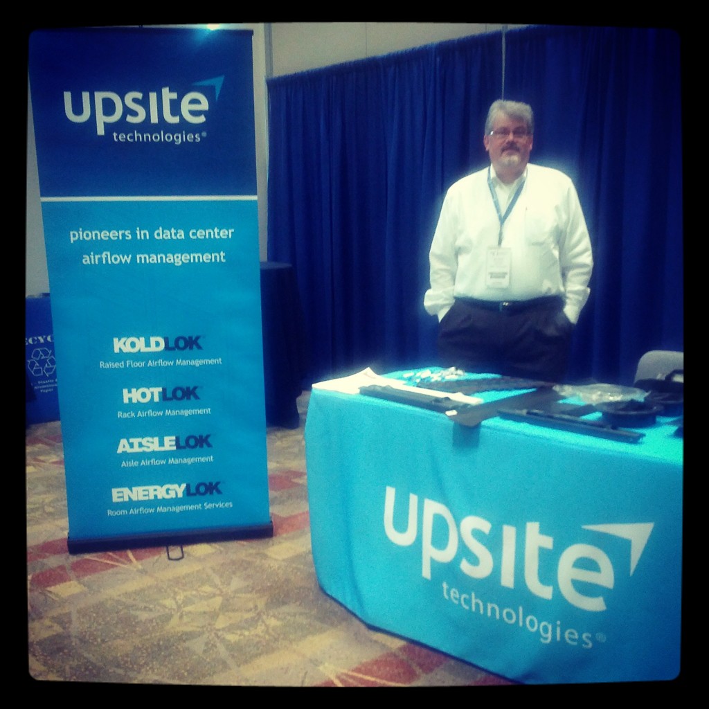 Upsite Technologies’ booth and President, Peter Crook.